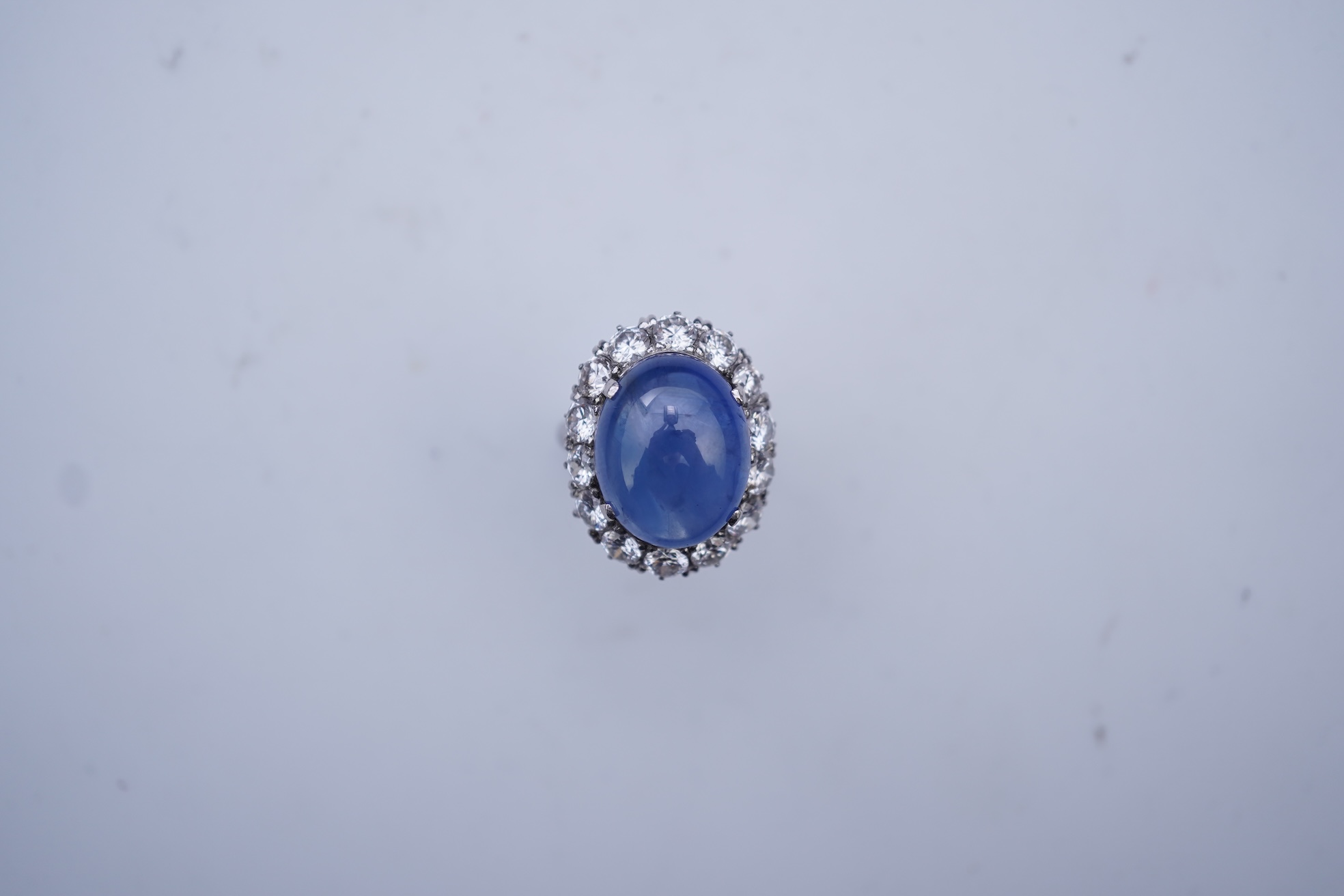 A sapphire and diamond ring, mid 20th century